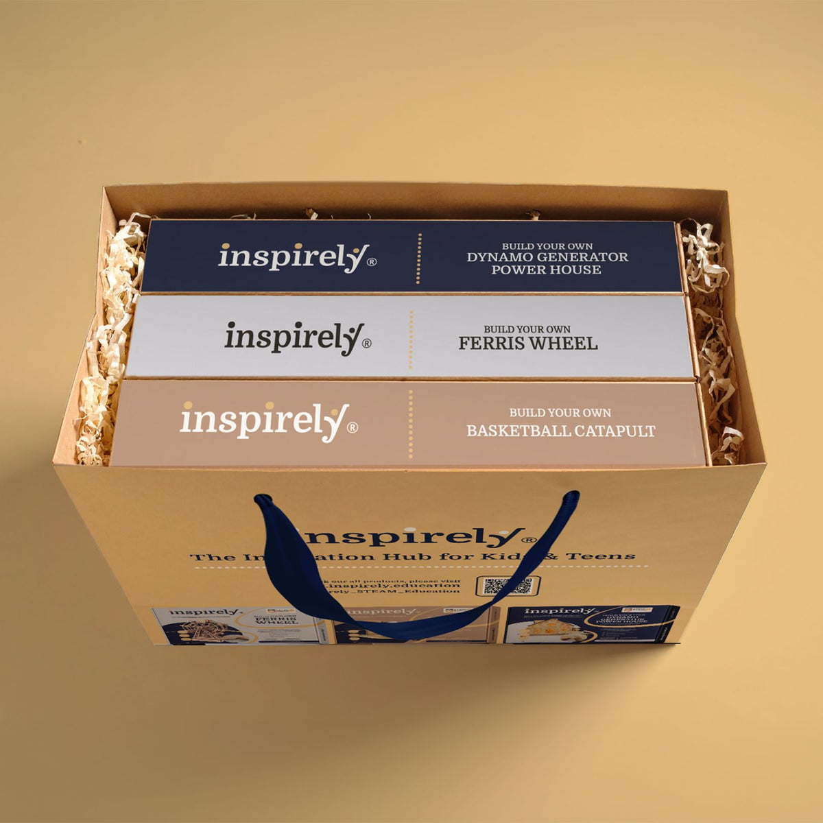 Actual Inspirely gift packaging holding Dynamo Generator Power House, Ferris Wheel and Basketball Catapult kit boxes.